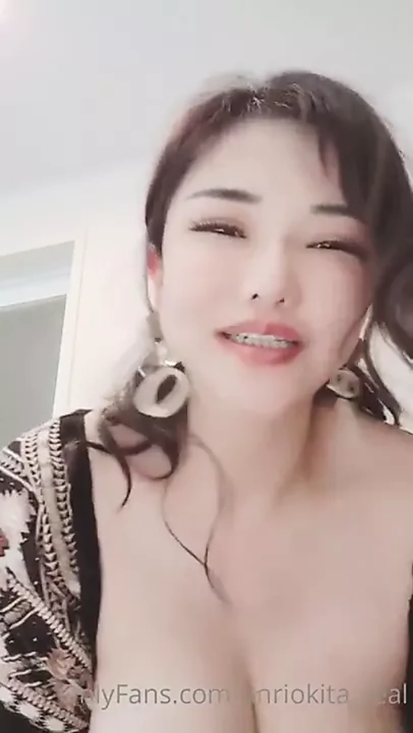 Asian milf exudes captivating allure.