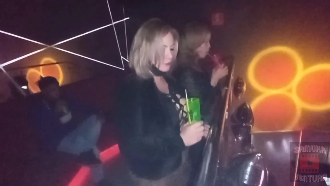Energetic milf captivates the club floor.