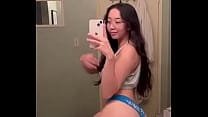Exotic teen camgirl flaunts curvaceous Asian charm.