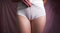 Intimate close-up reveals curvaceous charm in white.