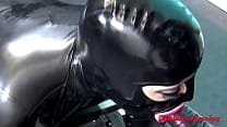 Latex-clad figures tantalize, rubbery whispers echo in video 3963.